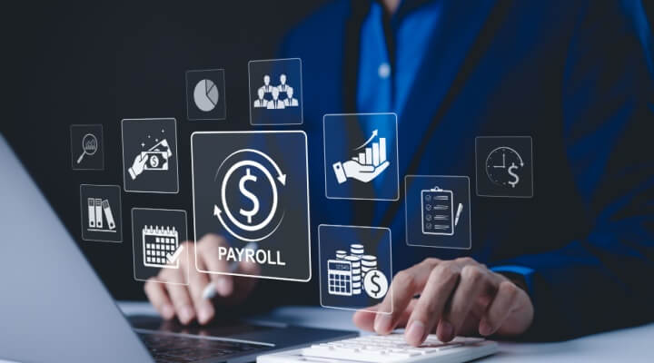 Man's hands work on keyboard, illustration of payroll BPO.