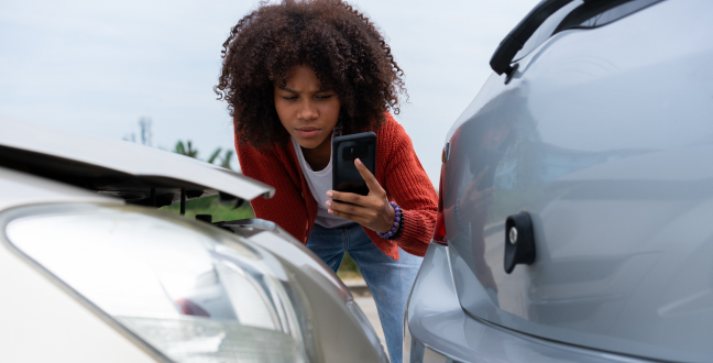 Driver check for damage after a car accident before taking pictures and sending insurance. Online car accident insurance claim.